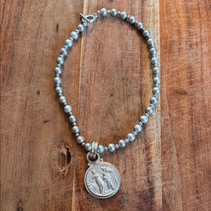 Elegant Silver Beaded Necklace with Medallion